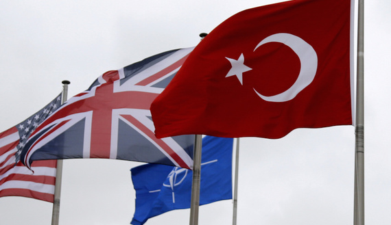 A Turkish flag (R) flies among others flags of NATO members during the North Atlantic Council (NAC) at the Alliance headquarters in Brussels, Belgium, July 28, 2015. REUTERS/Francois Lenoir/File Photo - RTSRWLT