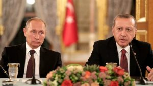 epa05580047 Russian President Vladimir Putin (L) and Turkey's President Recep Tayyip Erdogan (R) sit next to each other as they meet on the sidelines of the 23rd World Energy Congress, in Istanbul, Turkey, 10 October 2016. EPA/TOLGA BOZOGLU