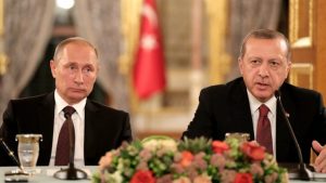 epa05580047 Russian President Vladimir Putin (L) and Turkey's President Recep Tayyip Erdogan (R) sit next to each other as they meet on the sidelines of the 23rd World Energy Congress, in Istanbul, Turkey, 10 October 2016.  EPA/TOLGA BOZOGLU
