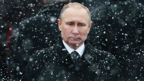 Snow falls as Putin attends a wreath-laying ceremony marking the Defenders of the Fatherland Day at the Tomb of the Unknown Soldier in Moscow, Russia, Feb 2017