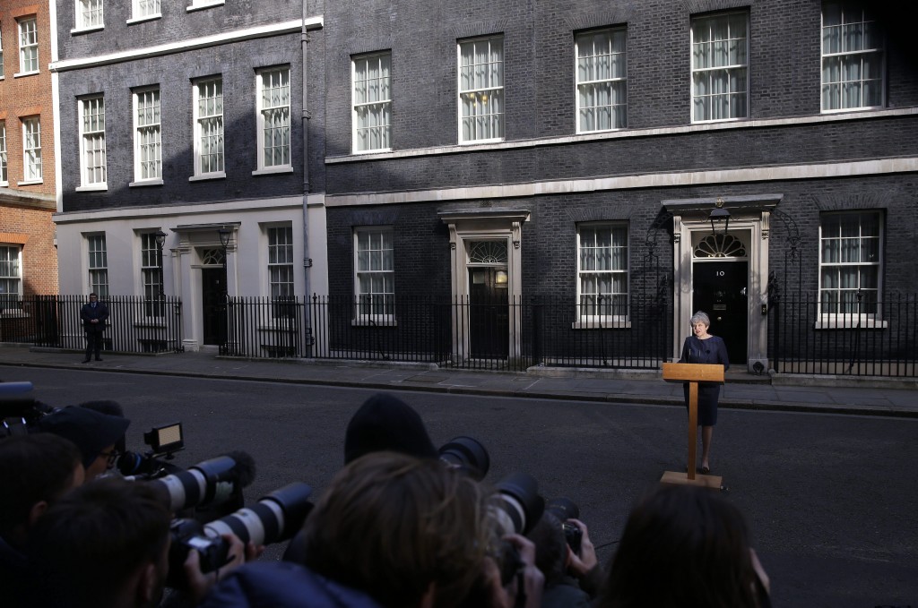 Britain's Prime Minister Theresa May speaks to the media outside her official residence of 10 Downing Street in London, Tuesday April 18, 2017. British Prime Minister Theresa May announced she will seek early election on June 8 (AP Photo/Alastair Grant)
