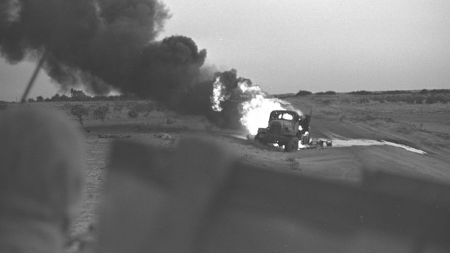 An Egyptian transport burning after a direct hit from an Israeli tank during the Six Day War, June 5, 1967. (David Rubinger/Government Press Office)