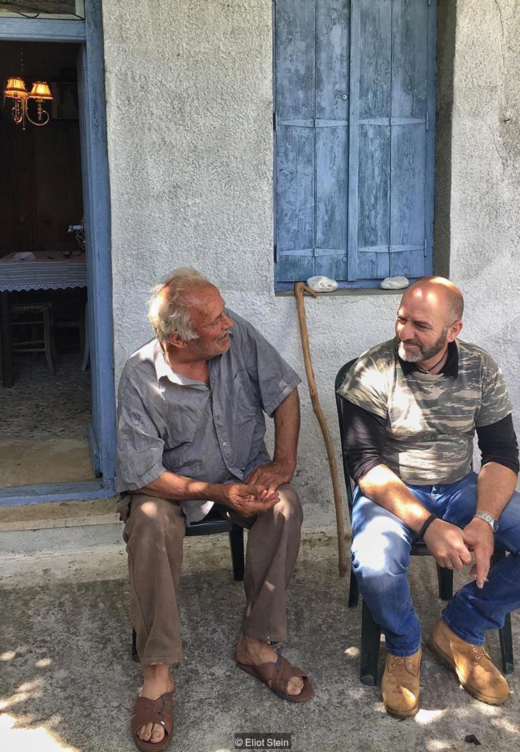 Yiannis Tsipas (right) hopes to one day teach sfyria to his son (Credit: Credit: Eliot Stein)
