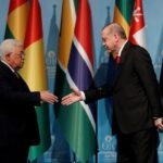 Turkish President Tayyip Erdogan and Palestinian President Mahmoud Abbas attend a news conference following the extraordinary meeting of the Organisation of Islamic Cooperation (OIC) in Istanbul
