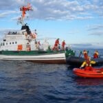 Frontex officials rescueing  refugees in international waters near Lesbos island